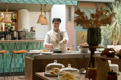 a man standing in a kitchen preparing food at Les Jardins De La Médina in Marrakech