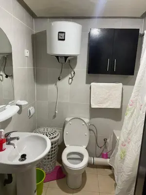 a small bathroom with a toilet and a sink at Appartement 24 4èm étage avec balcon ( POUR FAMILLE ) in Marrakech