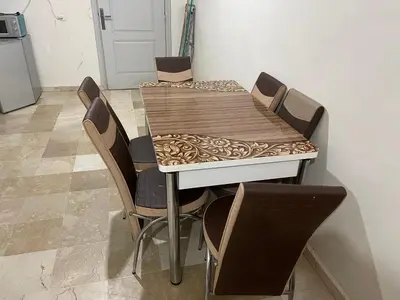 a dining room table with a table cloth on it at Appartement 25 4èm étage ( POUR FAMILLE ) in Marrakech