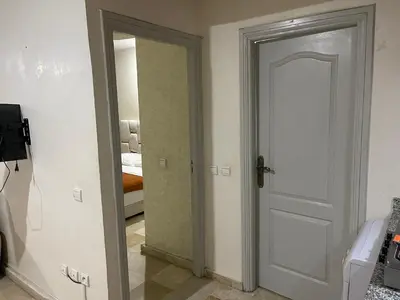 a room with a door leading to a bedroom at Appartement 27 au 4ème étage ( POUR FAMILLE ) in Marrakech