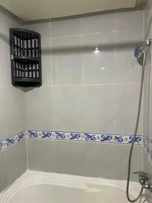 a bathroom with a bath tub and a shower at Appartement 27 au 4ème étage ( POUR FAMILLE ) in Marrakech