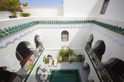 an overhead view of a building with a pool at Riad Maison Belbaraka in Marrakech