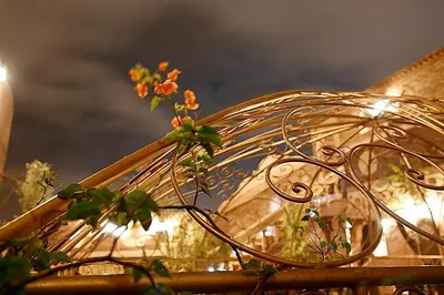 a close up of an umbrella with flowers on it at Riad Mille Et Une Nuits in Marrakech