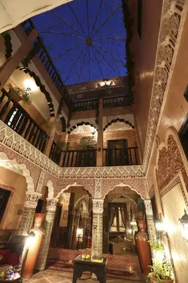 a building with a ceiling with a blue ceiling at Riad Mille Et Une Nuits in Marrakech