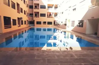 a swimming pool in the middle of a building at Bitty Apartment in Marrakech