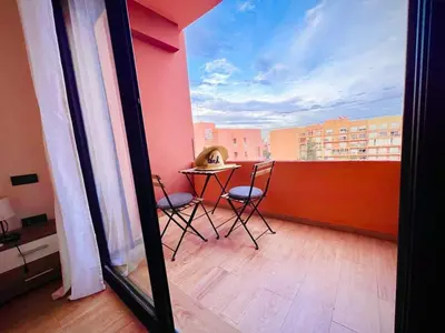 a view of a balcony with a table and chairs at Bitty Apartment in Marrakech