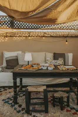 a table with food on it in a tent at Riad Djebel in Marrakech