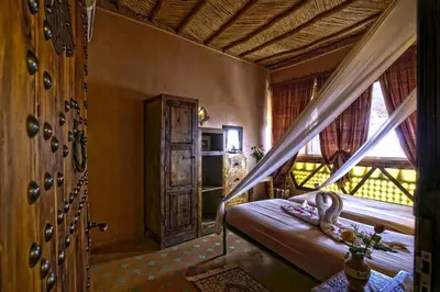 a bedroom with a bed with a snake on it at Hotel Kasbah Le Mirage & Spa in Marrakech