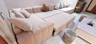 a white couch with pillows in a living room at Magnifique appartement à Riad Garden in Marrakech