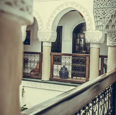 a view of a balcony of a building with columns at Riad Adriana in Marrakech