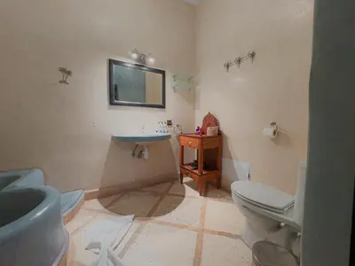 a bathroom with a sink and a toilet at Riad L'Orchidée Suites & Spa in Marrakech
