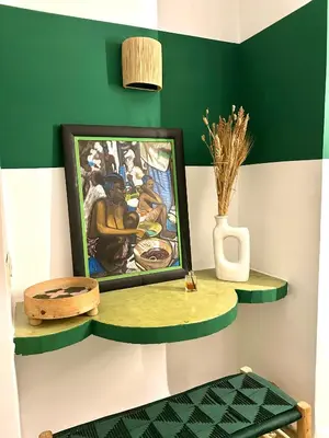 a painting on a shelf with a picture on it at Riad Lauriers Blancs in Marrakech