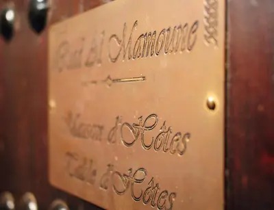a close up of a metal box with writing on it at Riad Al Mamoune in Marrakech