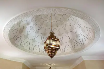 a chandelier hanging from a ceiling in a room at Villa Dar Mya Palmiers in Marrakech