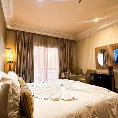 a bedroom with a large white bed in front of a window at Royal Mirage Deluxe in Marrakech