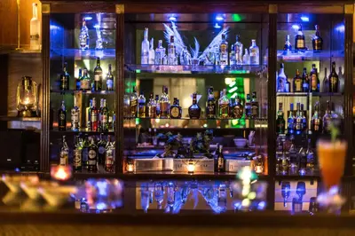 a bar filled with lots of bottles of alcohol at Royal Mirage Deluxe in Marrakech
