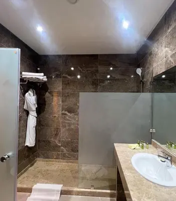 a bathroom with a sink and a shower at Royal Mirage Deluxe in Marrakech
