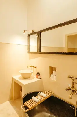 a bathroom with a sink and a mirror at Ryad Dyor in Marrakech