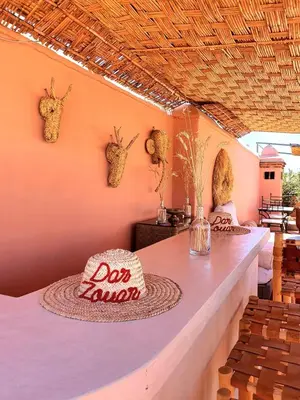 a room with a table and chairs and a tableablish at Riad Dar Zouar & Spa in Marrakech