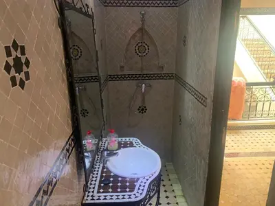 a bathroom with a sink and a shower at Riad jmiaa in Marrakech