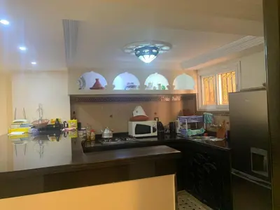 a kitchen with a counter top and a refrigerator at Riad jmiaa in Marrakech