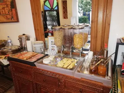 a buffet with many different types of food at Riad Karmela in Marrakech