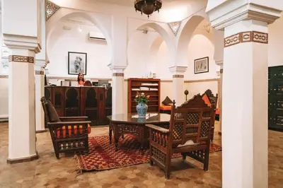 a dining room with a table and two chairs at Equity Point Marrakech in Marrakech