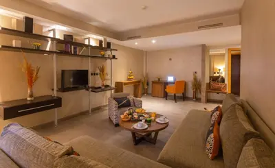 a living room with a couch and a table at Dellarosa Boutique Hotel and Spa in Marrakech