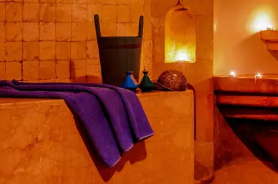 a bathroom with a purple towel on a table at Dellarosa Boutique Hotel and Spa in Marrakech