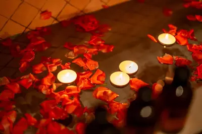 a group of candles with red roses at Al Fassia Aguedal in Marrakech