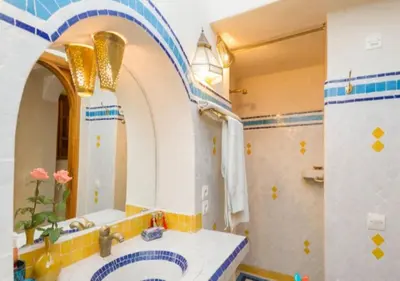 a bathroom with a sink and a mirror at Riad Maison Arabo-Andalouse in Marrakech
