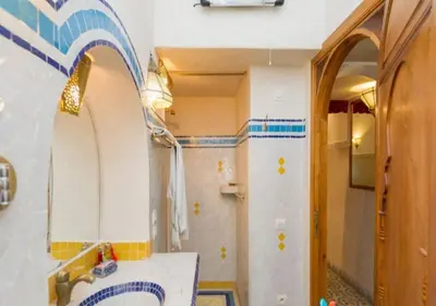 a bathroom with a sink and a mirror at Riad Maison Arabo-Andalouse in Marrakech