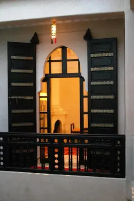 a view from a balcony of a building with two doors at Riad Diana in Marrakech