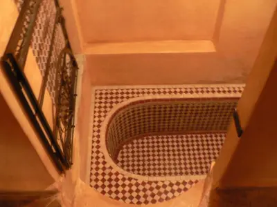 a box with a drain in the floor of a bathroom at Riad Dar Zaya in Marrakech