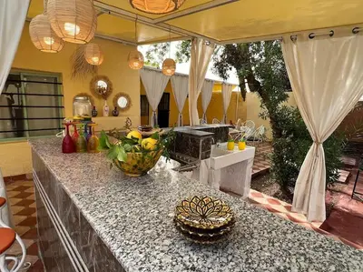 a kitchen with a counter with fruits on it at Villa Oasis de la Palmeraie in Marrakech