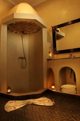 a bath room with a shower and a sink at Riad Les Hibiscus in Marrakech