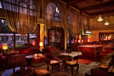 a lobby with couches and a pool table at El Andalous Lounge & Spa Hotel in Marrakech