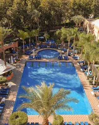 an overhead view of a pool at a resort at El Andalous Lounge & Spa Hotel in Marrakech