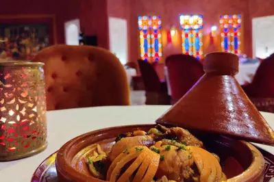 a plate of food on a table with a wooden funnel at Eden Andalou Aquapark & Spa in Marrakech