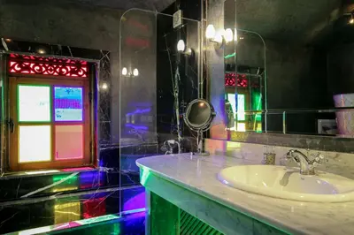 a bathroom with a sink and a mirror at Riad Alma in Marrakech