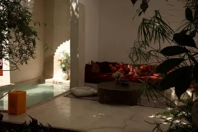 a living room with a couch and a table at Riad Davia in Marrakech