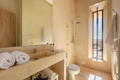 a bathroom with a sink and a toilet and a shower at La villa Kela Serene 4 suites in Marrakech
