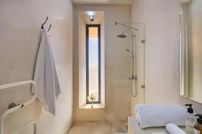 a bathroom with a shower and a sink at La villa Kela Serene 4 suites in Marrakech