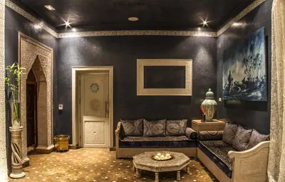 a living room with a couch and a table at Palais El Miria & SPA in Dar Caïd Layadi