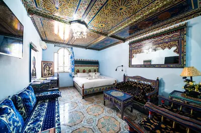 a room with a bedroom with a bed and a ceiling at Moroccan House in Marrakech