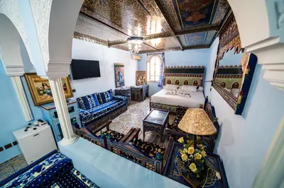 an overhead view of a room with a bed and chairs at Moroccan House in Marrakech