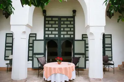 a table in the courtyard of a building at Riyad El Cadi in Marrakech