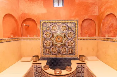 a bathroom with a mosaic tile on the wall at Palais les sources de l'atlas, Padel & spa in Marrakech