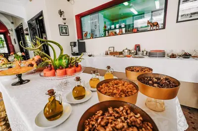 a buffet with bowls of food on a table at Les Borjs De La Kasbah in Marrakech
