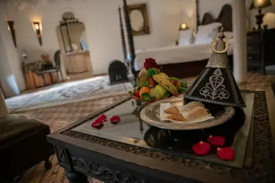 a table with a plate of food and a bell at Demeures d'Orient Riad & Spa in Marrakech